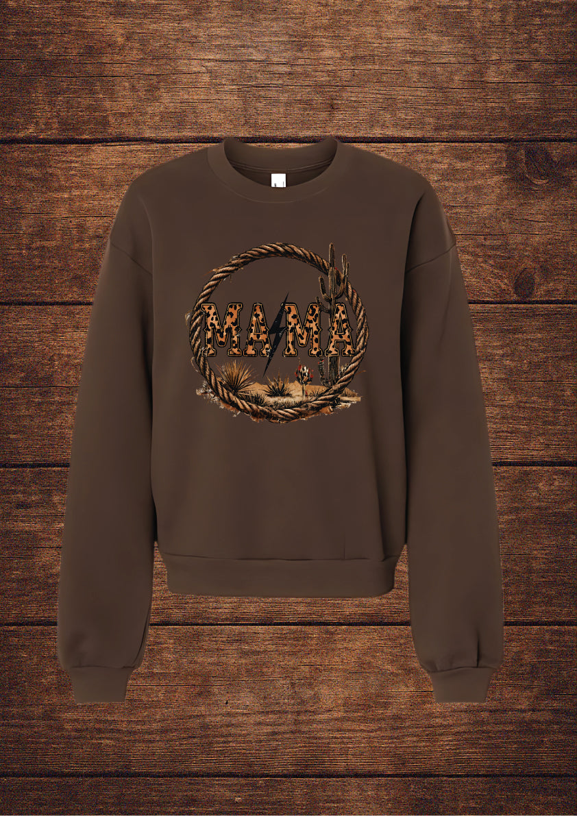 Brown sweatshirt with a graphic design on a wooden background