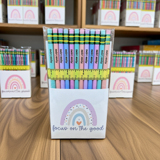 Custom back to school pencils, pastel color, sitting on a desk with multiple packs in the background.